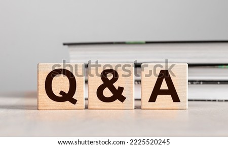 Q and A concept. QnA letters on wood blocks. Questions and answers. High quality photo