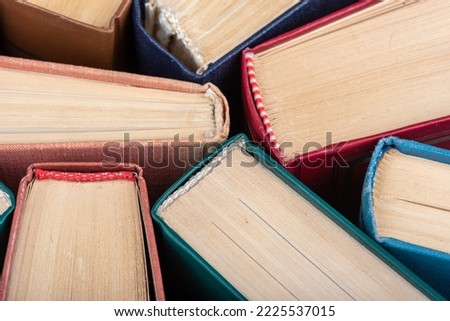 The spines of old books close up as a background. Knowledge concept.