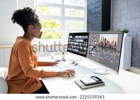 Video Editor Or Designer Using Editing Software Tech On Computer Royalty-Free Stock Photo #2225539363