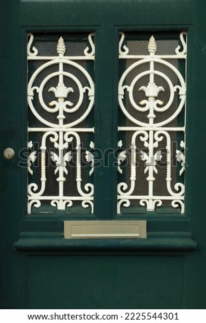Details of green front door with art nouveau ironwork, Utrecht, the Netherlands Royalty-Free Stock Photo #2225544301