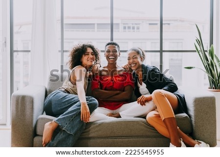 Happy beautiful hispanic south american and black women meeting indoors and having fun - Black adult females best friends spending time together, concepts about domestic life, leisure, friendship Royalty-Free Stock Photo #2225545955