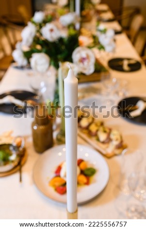 Beautiful event table setting with one candle