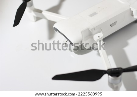 a close up of detailed white drone parts isolated on white background. drone camera photo concept.