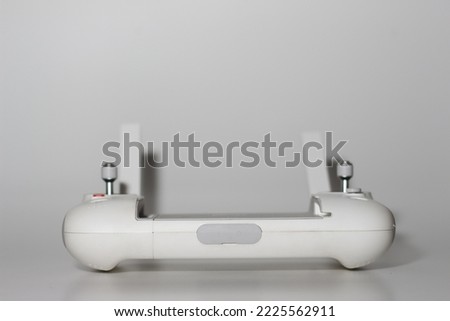 a close up of detailed white drone remote part isolated on white background. drone camera photo concept.
