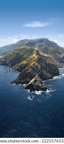 The mountain cliffs on the coast of the sea are suitable for mobile phone vertical screen poster propaganda background design material