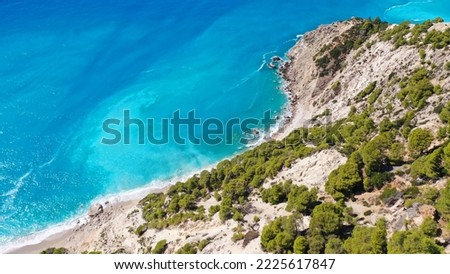 Aerial drone photo of famous paradise beach of Egremni white steep rocky hills overlooking deep turquoise Ionian sea, Lefkada island