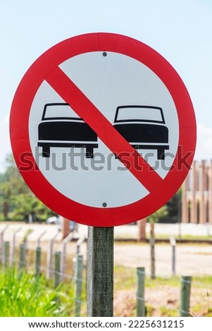 Forbidden to overtake: road sign closeup. Sao Paulo state, Brazil