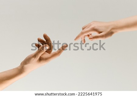 Moment Of Weightless Two Male Hands Trying To Touch Like Royalty-Free Stock Photo #2225641975