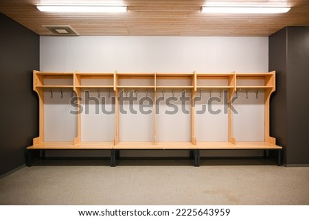 Wood locker room of a stadium Royalty-Free Stock Photo #2225643959