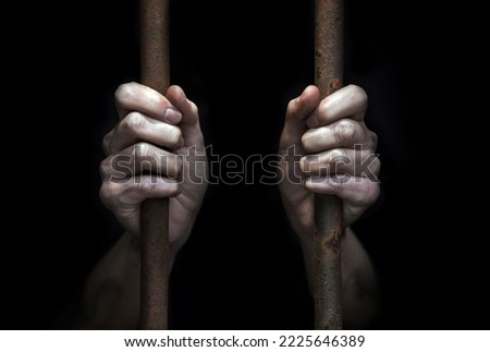 Close up old legal fear young adult lone sad male guy burglar guilt slave ask pray god help hope text space. Closeup illegal alone christian prayer sit hold fist social protect drug abuse thief victim Royalty-Free Stock Photo #2225646389