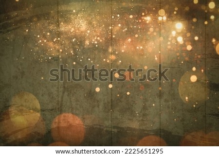 Shining christmas gold lights, bokeh particles on wooden vintage background, club party holiday copy space. Gold glitter texture isolated with bokeh on background. Particles celebration color.