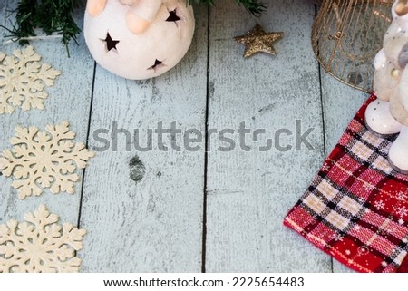 Christmas sock and ornaments on wooden table