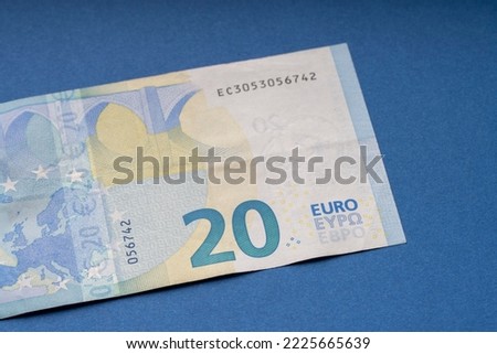 20 euro banknote close up, blue background for business finance topics. World money concept, inflation and economy concept. Currency close up in detail.