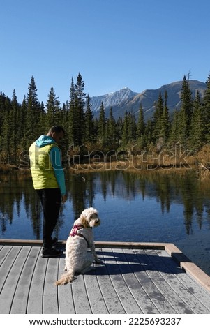 Man and Dog Hiking in Canadian Rockies
