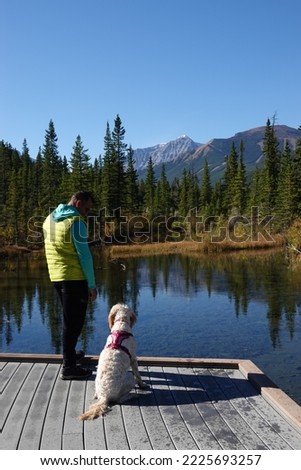 Man and Dog Hiking in Canadian Rockies