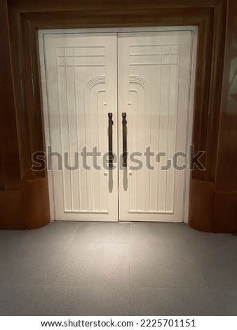 an elegant white door in a cinema