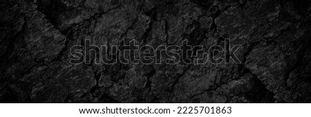 Black rock texture. Rough mountain surface with cracks. Close-up. Dark stone background with space for design. Grunge. Banner. Wide. Long. Panoramic.  Royalty-Free Stock Photo #2225701863