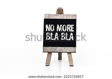 No more bla bla, chalk text on blackboard Royalty-Free Stock Photo #2225726857
