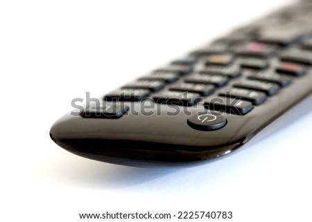 Cutout Black remote control for TV on white background