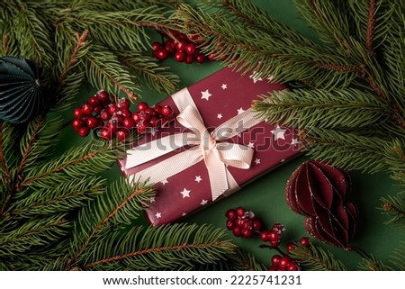 Christmas present on green background.