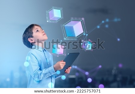Child boy using tablet and looking up, digital hologram hud of blocks and network. Information fields and blockchain. Concept of metaverse Royalty-Free Stock Photo #2225757071