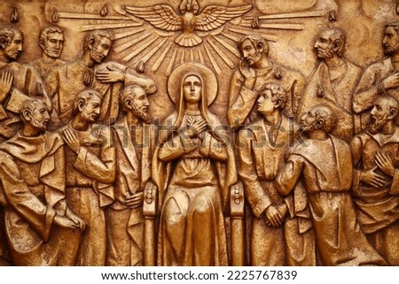 Sanctuary of Fatima.  Golden bas-relief of the old Basilica of Fatima representing one of the fourteen mysteries of the rosary, similar to the stations of the cross. The Descent of the Holy Spirit. Royalty-Free Stock Photo #2225767839