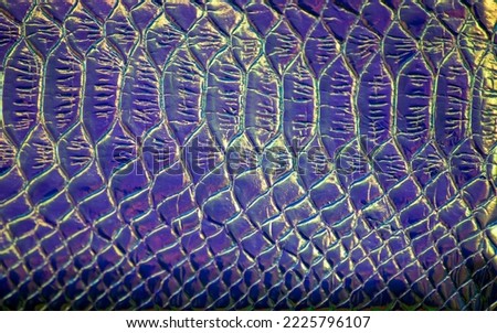 Blurred focus. Holographic background. Texture of snake skin.