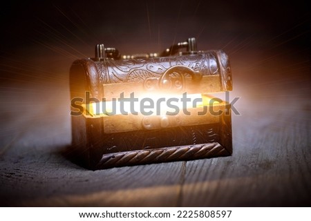 Pandora box, old chest with opening lid and bright inside light, fabulous wealth concept, pirate treasures, pandora's box, in search of treasure, fairy tale