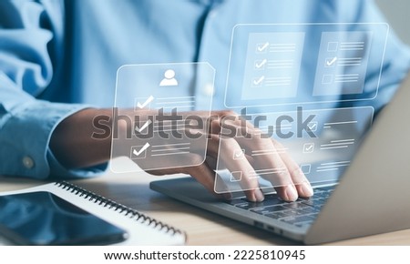 Business and technology concept. Fill out an online employee assessment form. Human resource management, HR, recruitment, leadership and teambuilding. Royalty-Free Stock Photo #2225810945