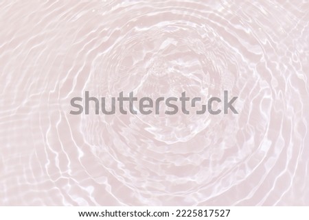 Defocus blurred transparent gray colored clear calm water surface texture with splashes and bubbles. Trendy abstract nature background. Water waves in sunlight with copy space. Gray watercolor shining