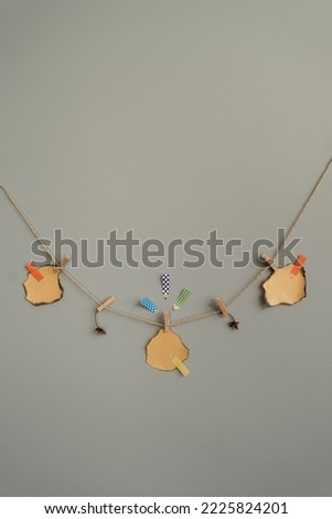 Stickers on the wall for notes. Hanging on a rope, on a clothespin, suitable for inscriptions