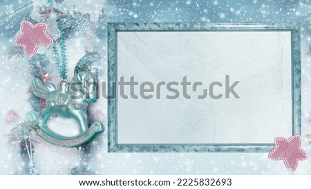 Christmas card tinted in pastel colors with an empty frame for greeting text. Selective focus