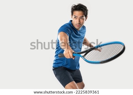 Male tennis player playing tennis with striving for victory gesture on white background.