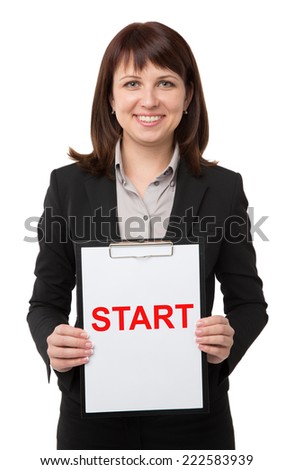 Businesswoman carrying clipboard with start card