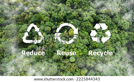 Reduce, reuse, recycle symbol in the middle of a beautiful untouched jungle. Ecological concept. An ecological metaphor for ecological waste management and a sustainable and economical lifestyle. Royalty-Free Stock Photo #2225844343