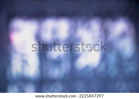 ABSTRACT DARK BLUE BLURRED BOKEH LIGHTS BACKGROUND WITH PURPLE GRADIENT