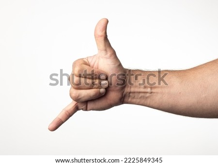 A man's hand and arm on a nuclear white background, showing a gesture of greeting approval or positivity.