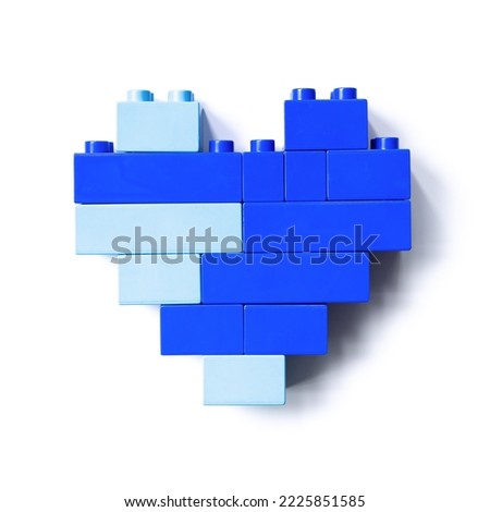Blue heart of toy blocks isolated on white background, top view cut out object, design element, shape heart from child constructor. Love concept, Valentine card, Toys, games, two color, light and dark Royalty-Free Stock Photo #2225851585