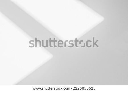Abstract light reflection and grey shadow from window on white wall background. Gray shadow and sunshine diagonal geometric overlay effect for backdrop and mockup design
