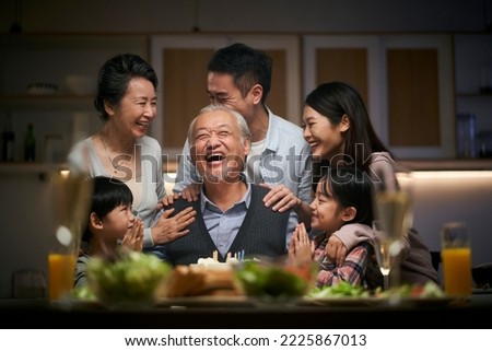 happy three generation asian family celebrating grandpa's birthday at home Royalty-Free Stock Photo #2225867013
