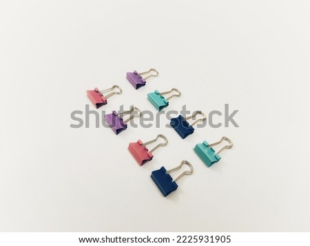 Binder clips set concept business office accessory for documents and note. Colorful binder clips isolated on white background 