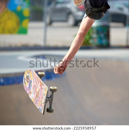 Skate boarder fails to catch his board while doing a flip. Failure to succeed 