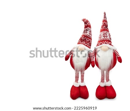 
Two Gnomes a Christmas elf wearing red hat isolated on white background.