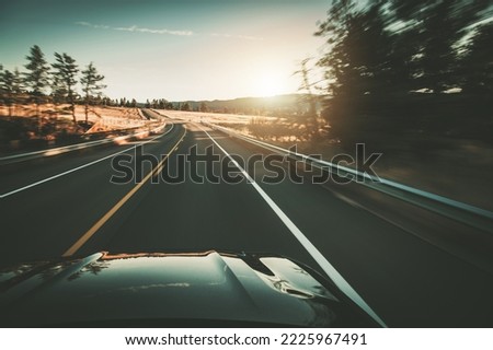 Traffic Free Open Road Driver During Sunset. Motion Blur. Car Drive Theme.