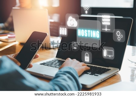 Web hosting concept, Man using computer and presses his finger on the virtual screen inscription Hosting on desk, Internet, business, Technology and network concept.