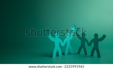 Successful Teamwork Concepts. Paper Cut as Group of Worker Raise Up a Star Together. Business Strategy. Working to Committed and Towards a Shared Goal. Colleagues or Partnership Celebrating a Success Royalty-Free Stock Photo #2225991965