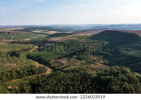Beautiful late Summer aerial drone landscape image of heather in full bloom in Peak District Royalty-Free Stock Photo #2226033019