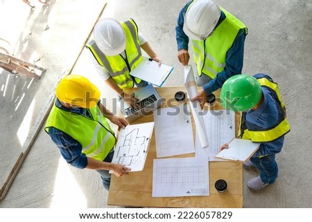 engineering teamwork meeting on site work,engineers project manager consultation meeting with coworker.concept of engineering or architecture working outdoors for a new real estate home project Royalty-Free Stock Photo #2226057829