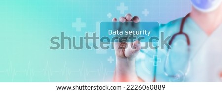 Data security. Doctor holds virtual card in hand. Medicine digital