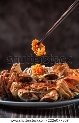 Fresh and delicious hairy crab or chinese mitten crab with crab roe on table